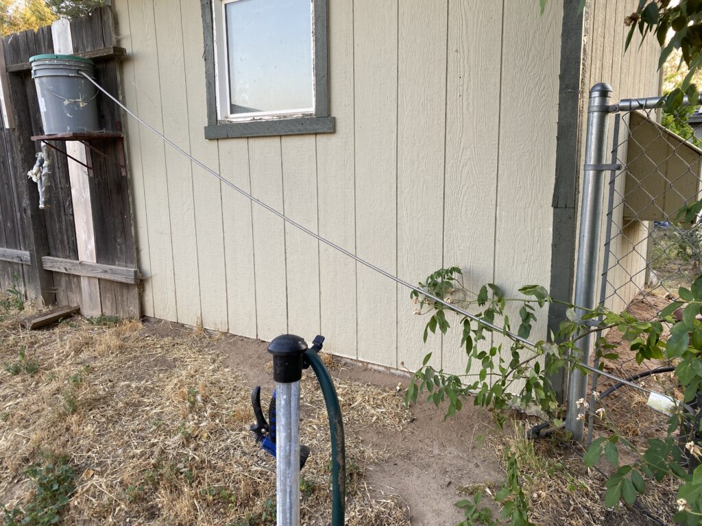 Bucket fed by a flexible hose from a standing hose bib